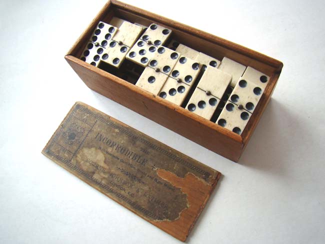 A boxed set of Civil War era bone and ebony dominoes circa 1860-1870